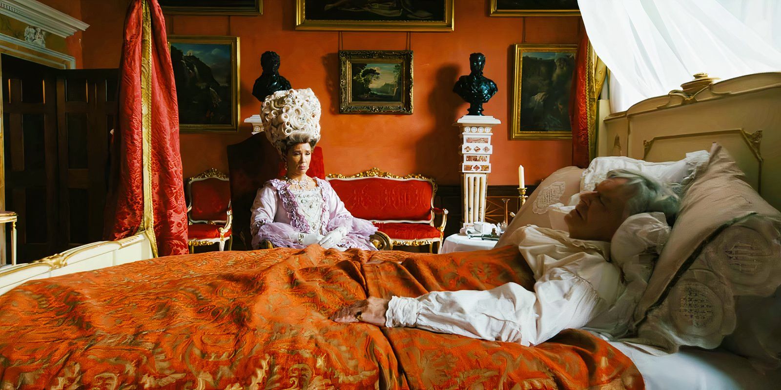 Golda Rosheuvel as Queen Charlotte byt the bedside of James Fleet as King George in Bridgerton season 2