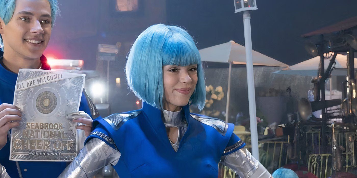 Kyra Tantao smiles while wearing a blue wig in Zombies 3