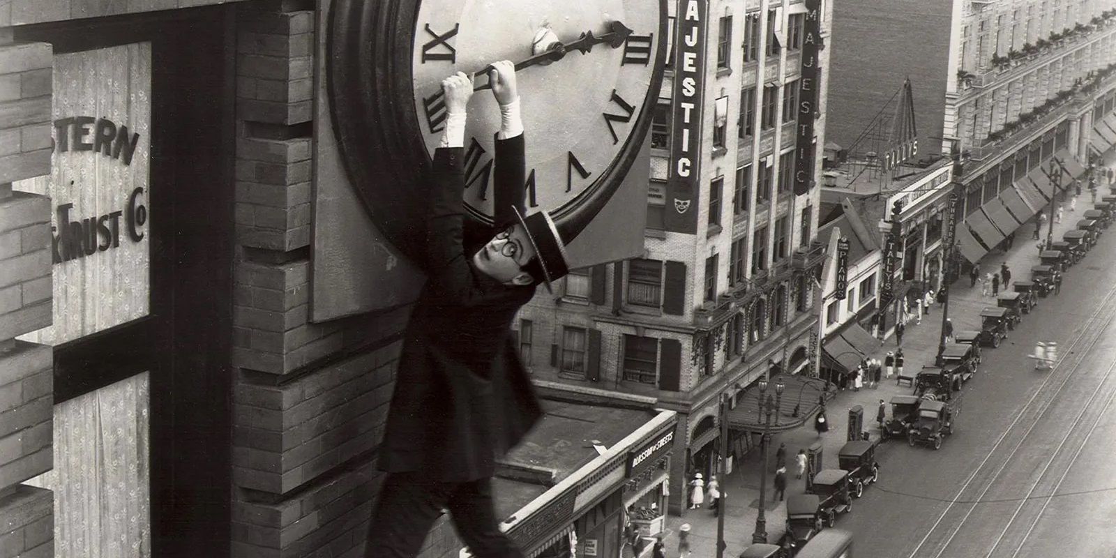 Harold Lloyd dangles from a clock in Safety Last