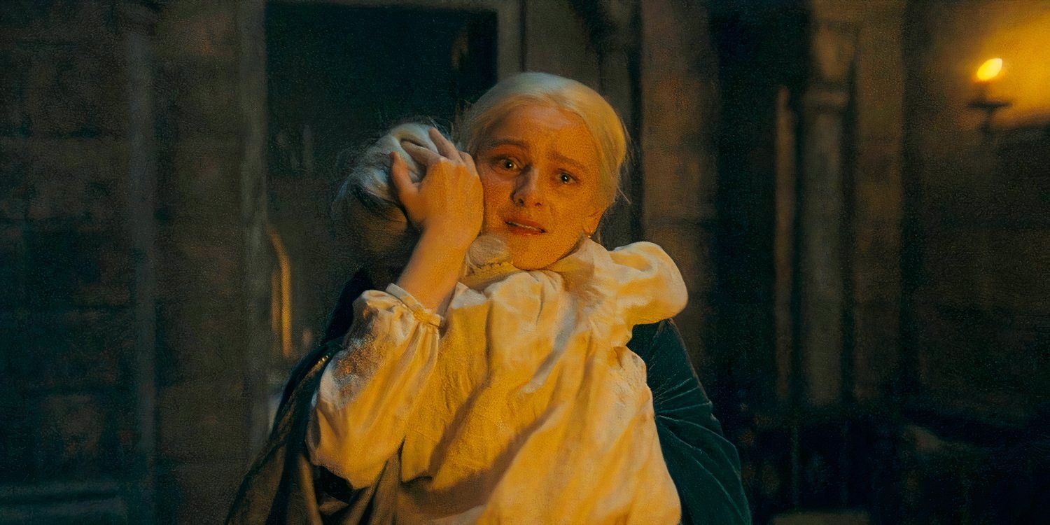 Helaena Targaryen (Phia Saban) holding Jaehaera in her arms, trying to protect her in House of the Dragon season 2 episode 1