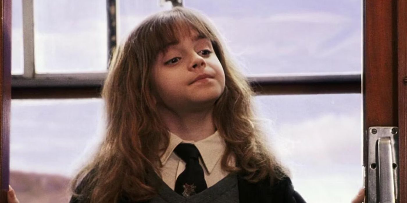 Hermione (Emma Watson) looking smug on the Hogwarts Express in Harry Potter and the Sorcerer's Stone.