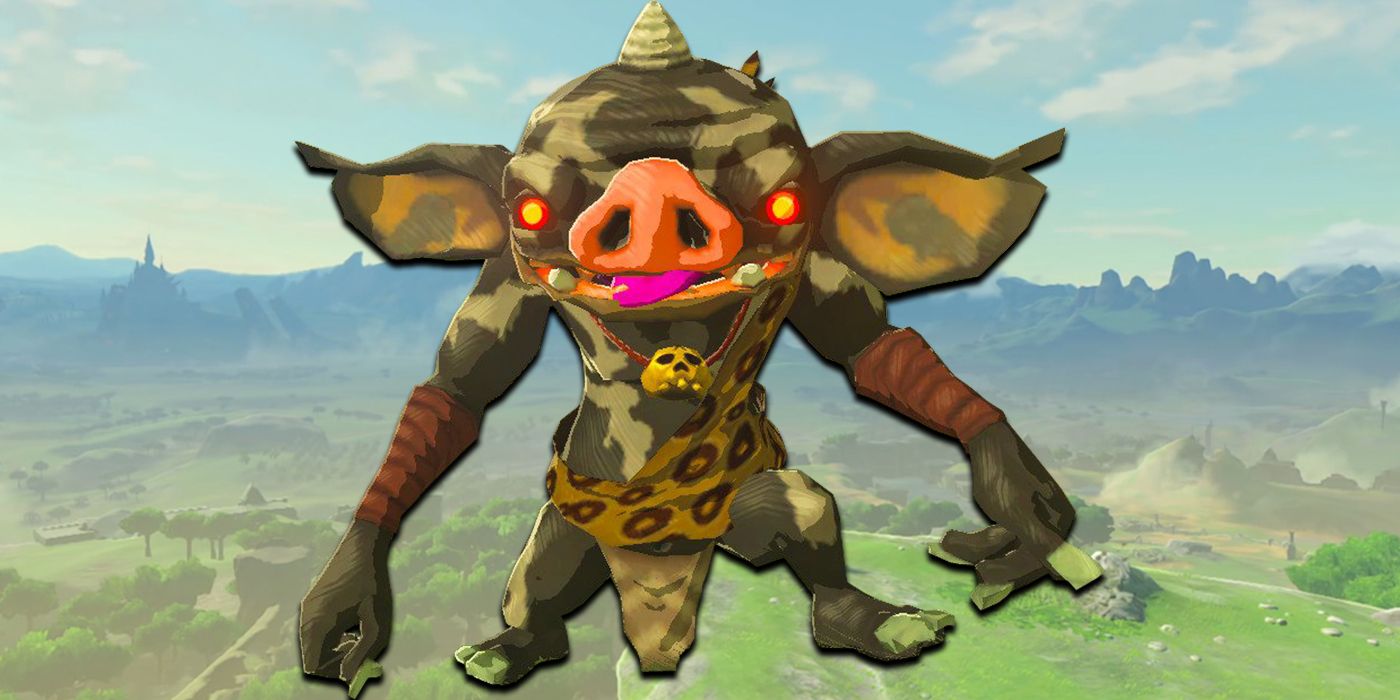 A Bokoblin with red eyes, gray skin with white swirls, and a leopard print sash, stands staring at the camera with its tongue sticking out. 