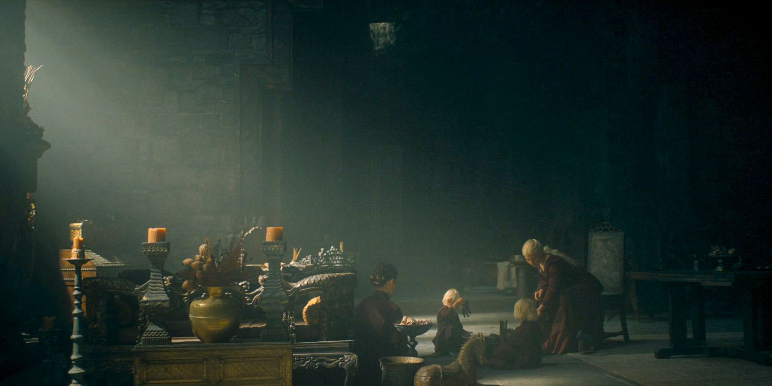 Uma tomada ampla de Rhaenyra Targaryen (Emma D'Arcy) brincando com seus filhos bebês no episódio 2 da 2ª temporada de House of the Dragon