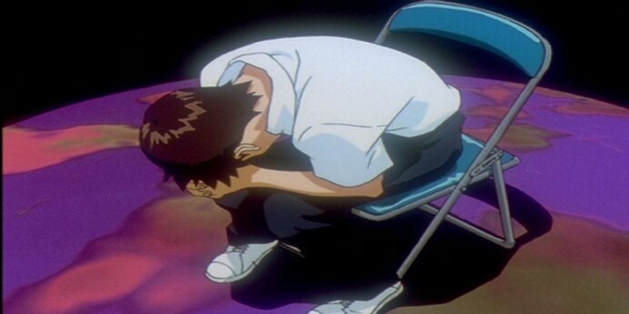 Image of Shinji Ikari sitting on a chair hunched over