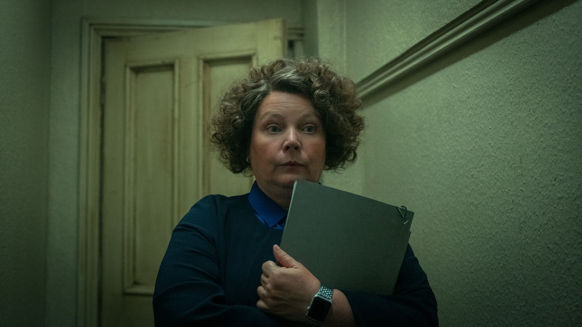 Joanna Scanlan walks around, nervously clutching her briefcase, in a scene from Season 4 of Slow Horses