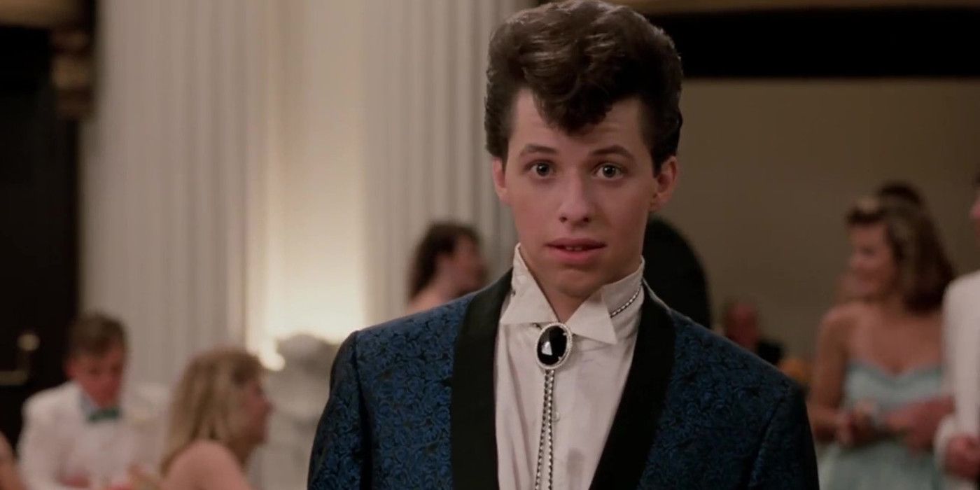 John Cryer wearing a white shirt and blue jacket in Pretty in Pink
