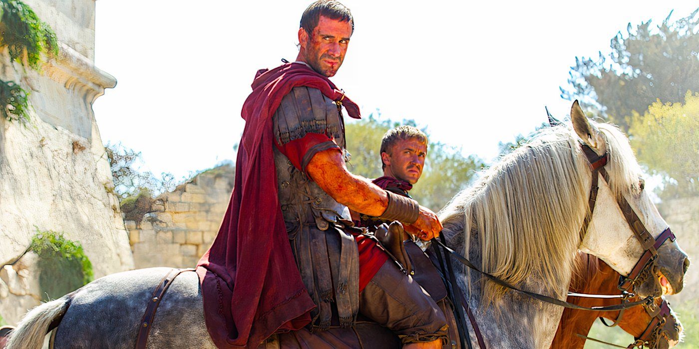 Joseph Fiennes and Tom Felton wearing Roman military uniforms and riding horses in Risen