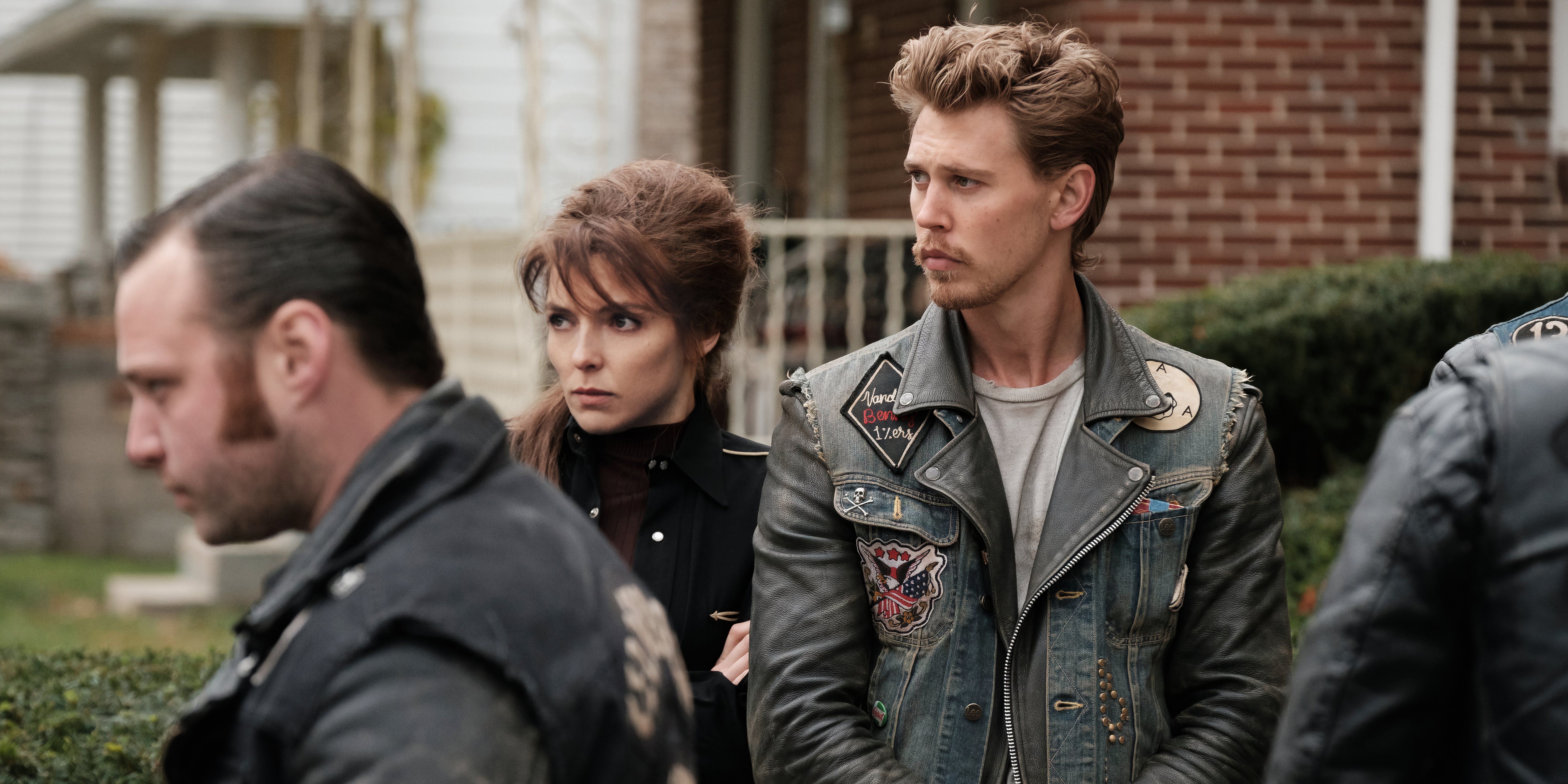 Kathy and Benny at a funeral in The Bikeriders movie still
