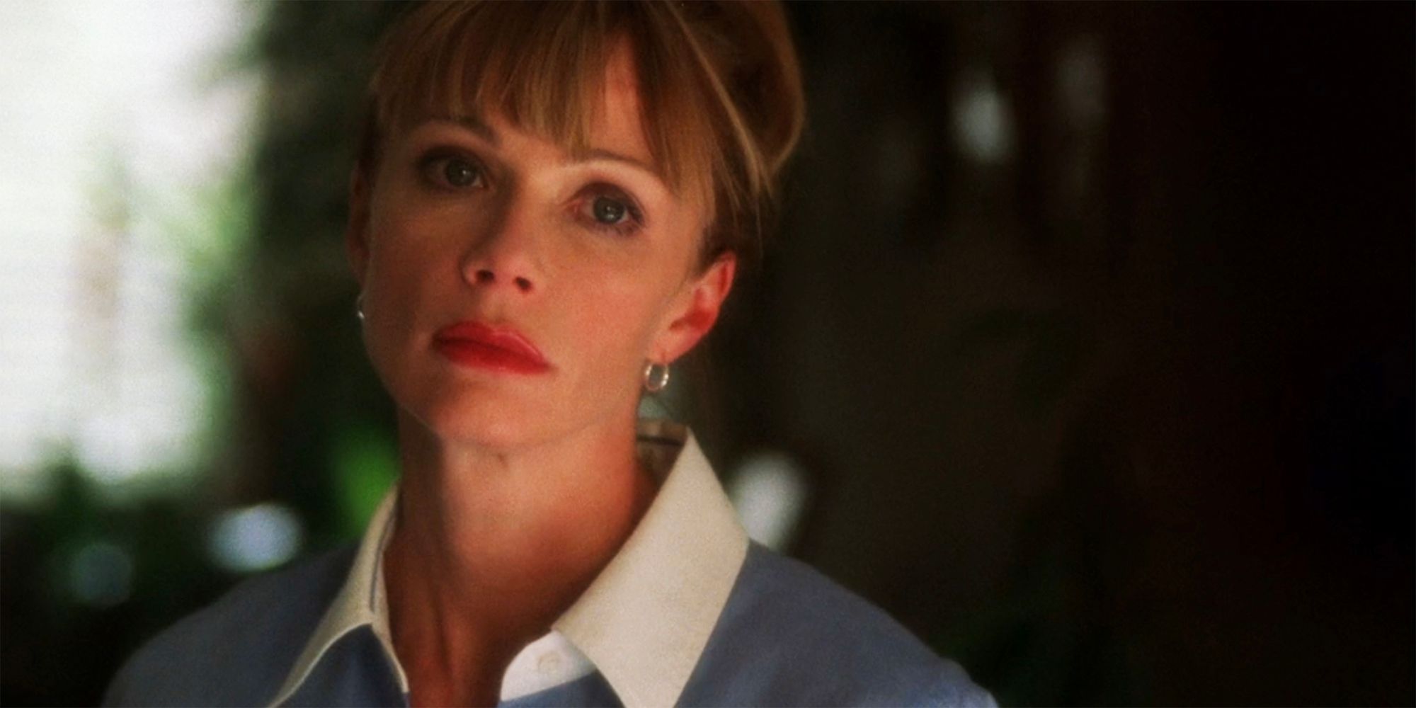 Lauren Holly's Jennifer Shepard looking seriously at something off camera in NCIS