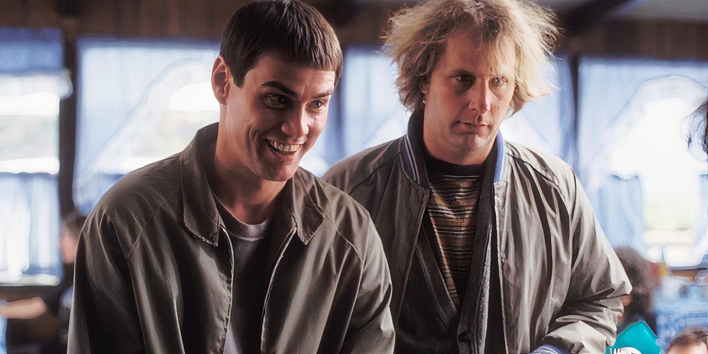 Lloyd (Jim Carrey) smiling and Harry (Jeff Daniels) looking confused in Dumb and Dumber