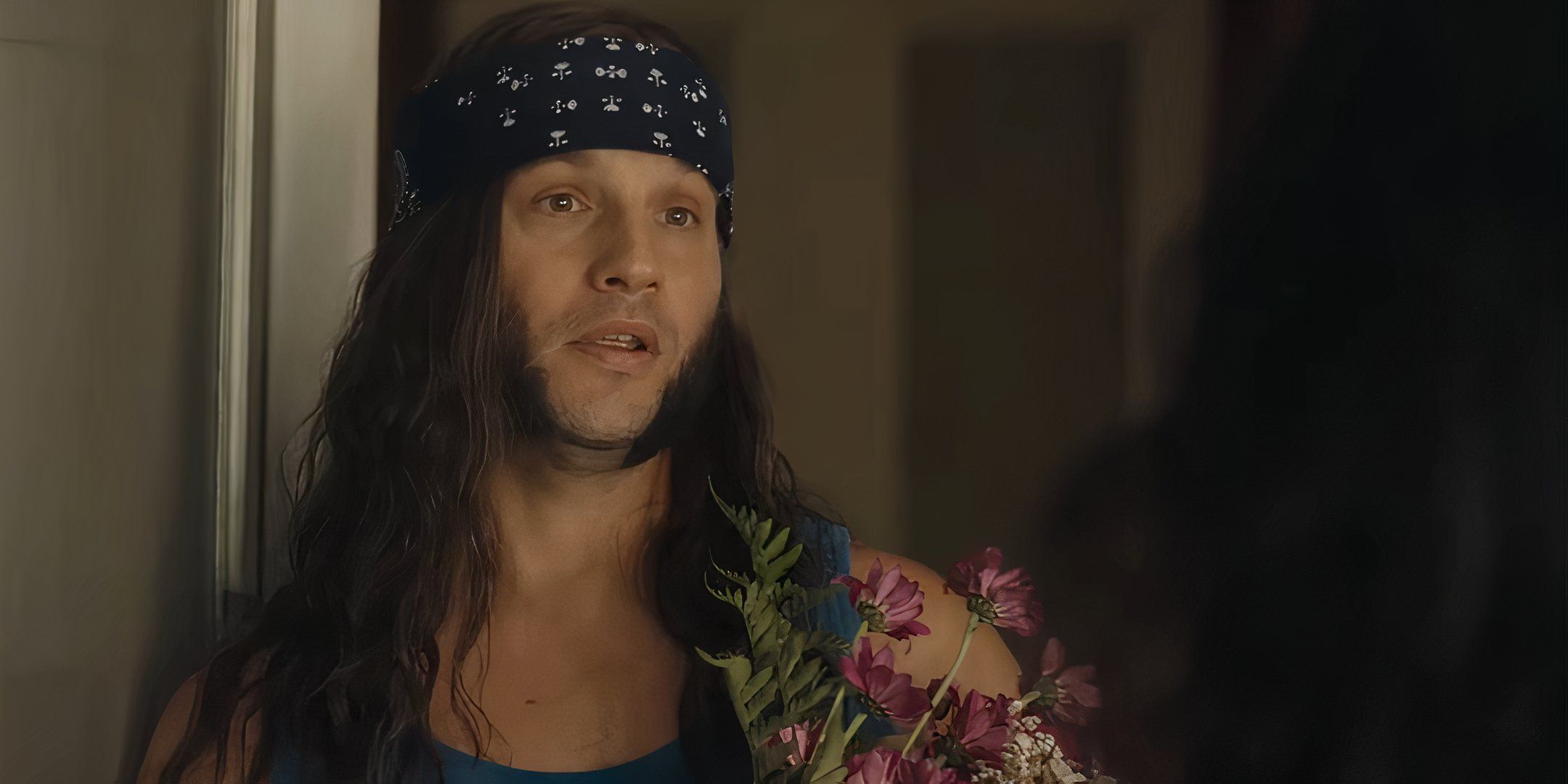Logan Marshall-Green as Ted holding flowers and talking to Mariana in Reverse the Curse