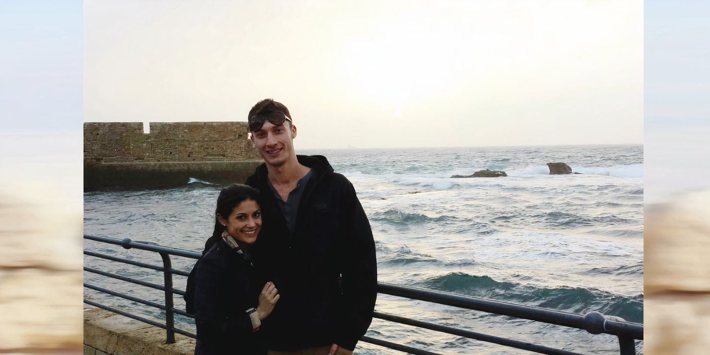 Loren and Alexei Brovarnik In 90 Day Fiance standing by the sea in black jackets