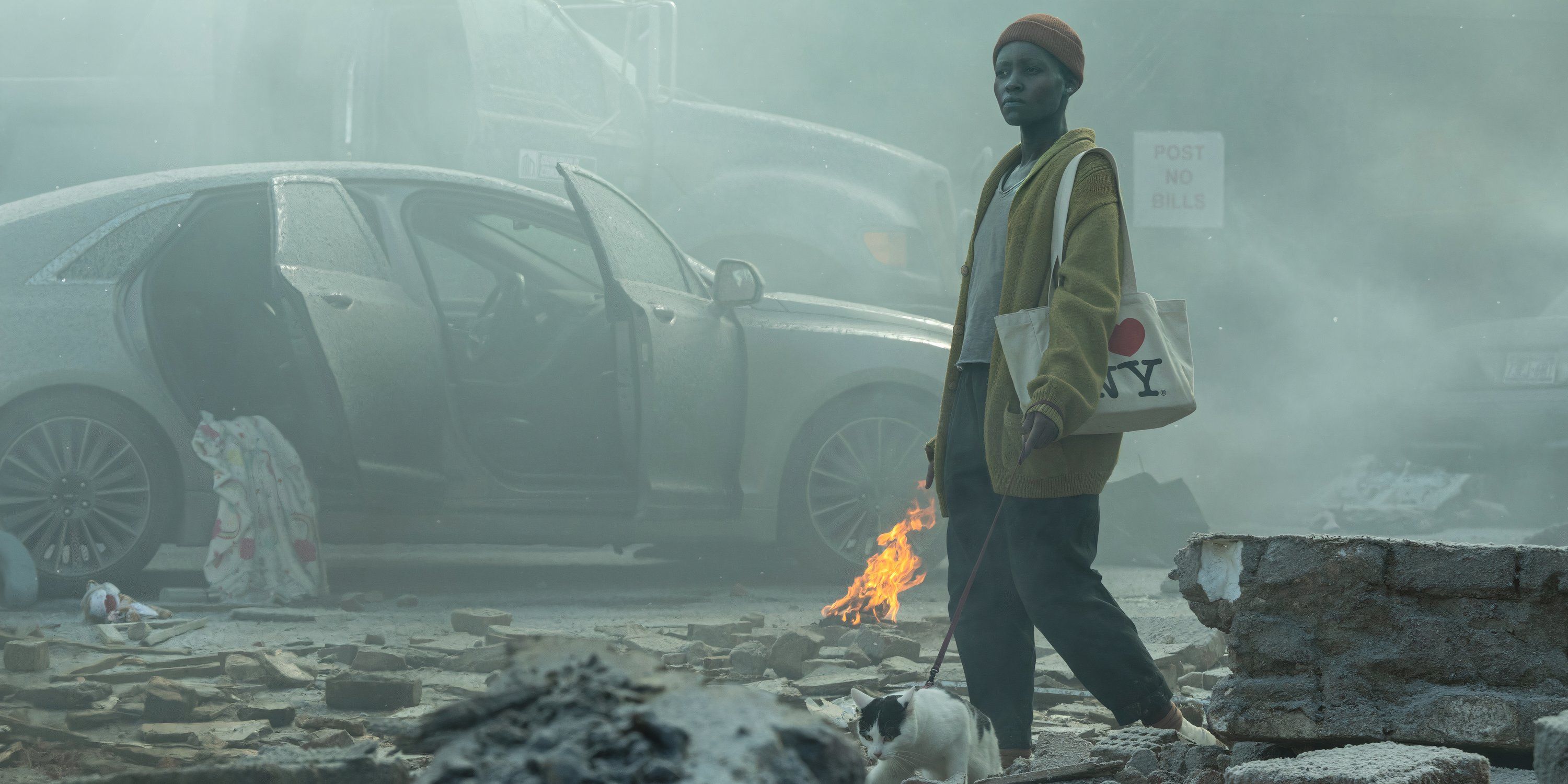 Lupita Nyong'o as Sam wanders through the destroyed city streets in A Quiet Place Day One still