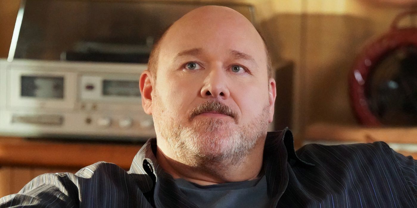 Jim McAllister (Will Sasso) looks up sternly in Young Sheldon