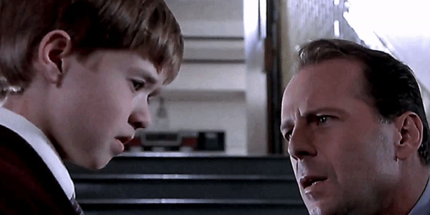Malcolm leans down to Cole in The Sixth Sense-1