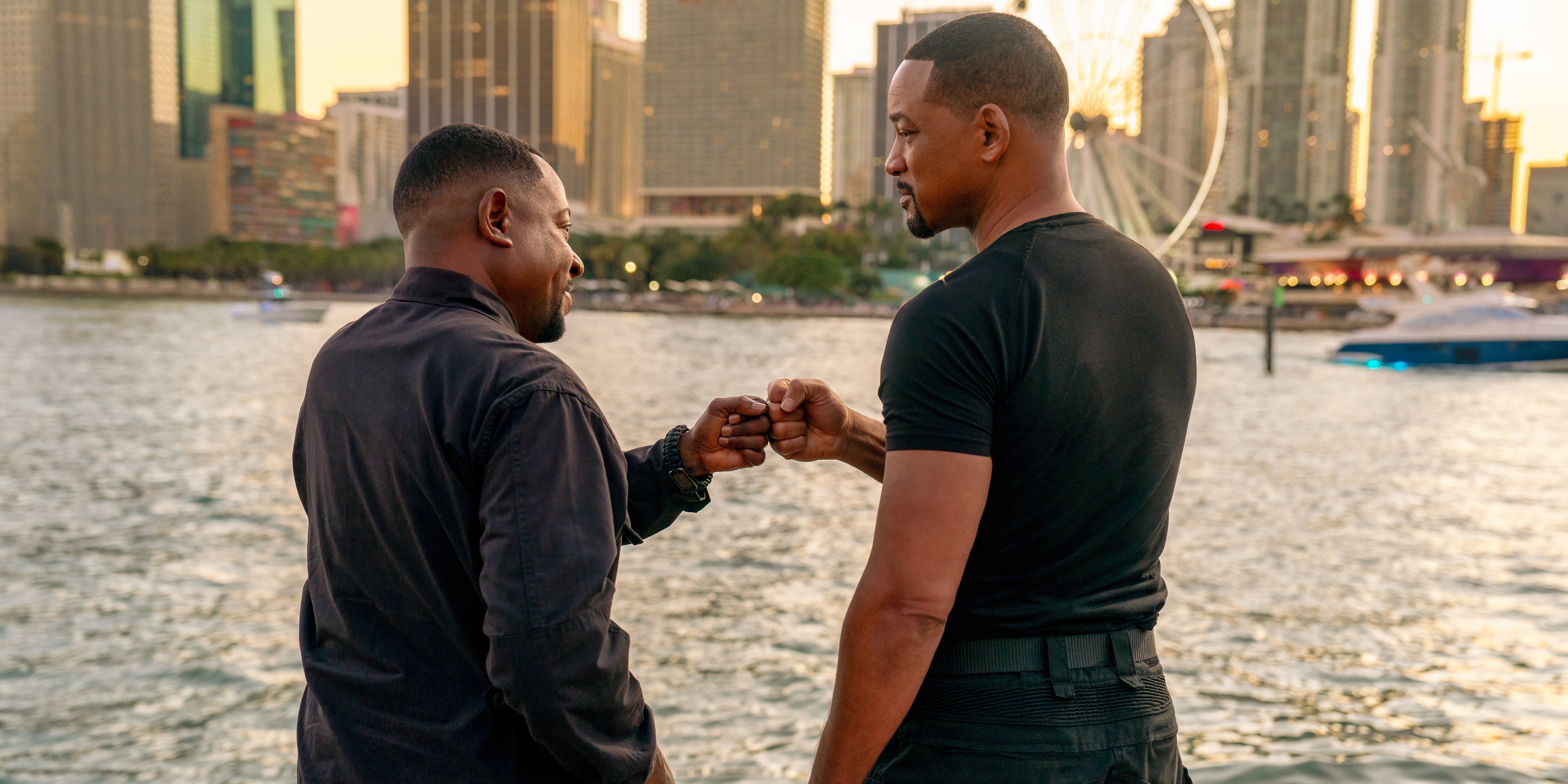 Martin Lawrence as Marcus and Will Smith as Mike bump fists in Bad Boys Ride or Die