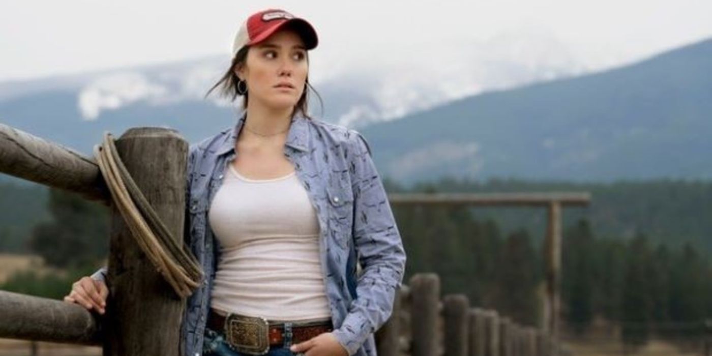 Mia (Eden Brolin) leaning on a fence and looking worried in Yellowstone.-1