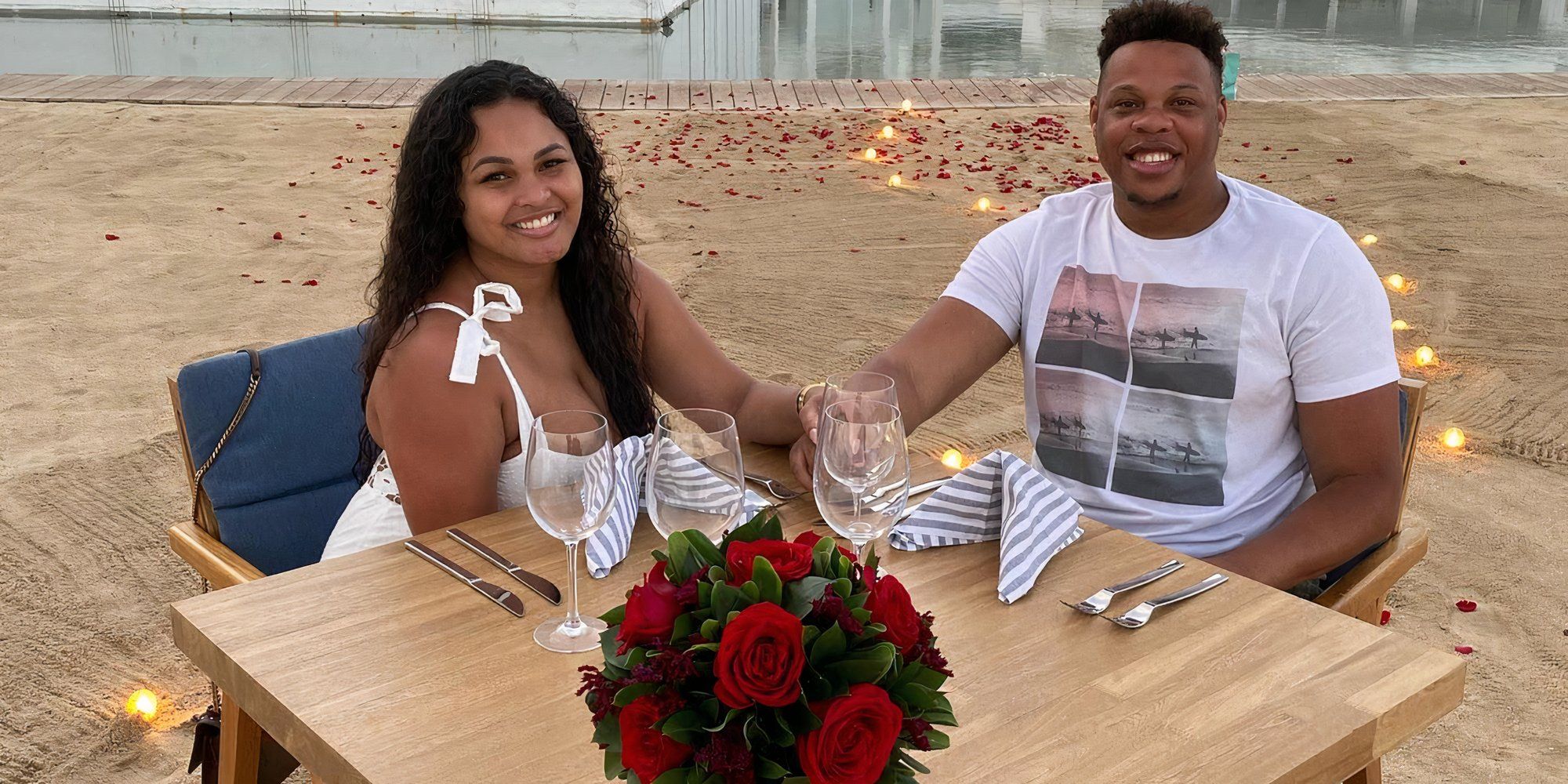 Married At First Sight Tristan Thompson with wife Rachel White holding hands while sitting at a table