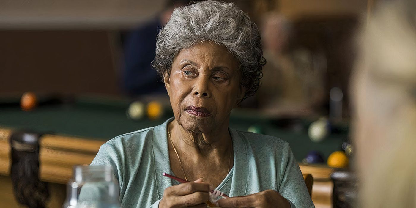 Myrtle (Phyllis Applegate) knitting at a table in Better Call Saul.