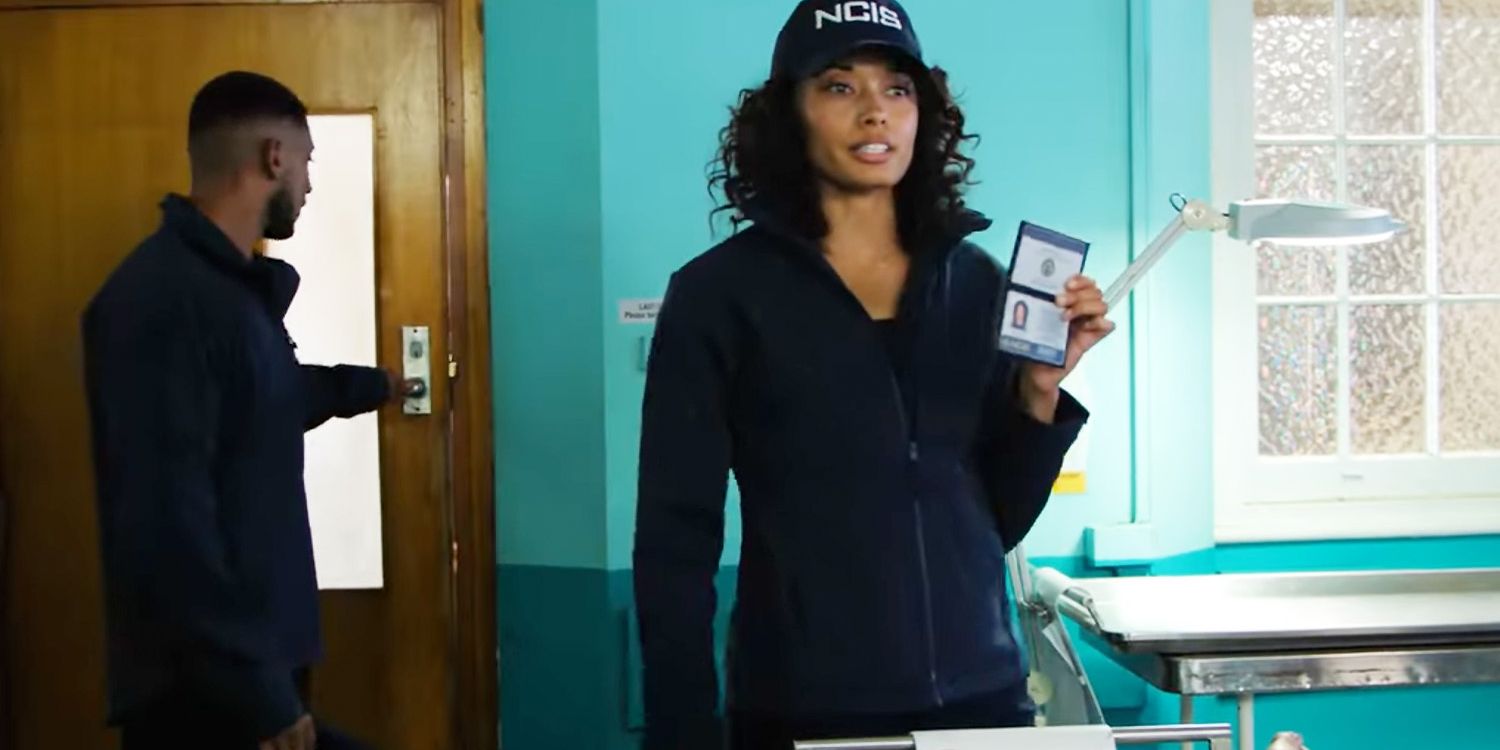 NCIS Sydney Michelle Mackey holding up her badge