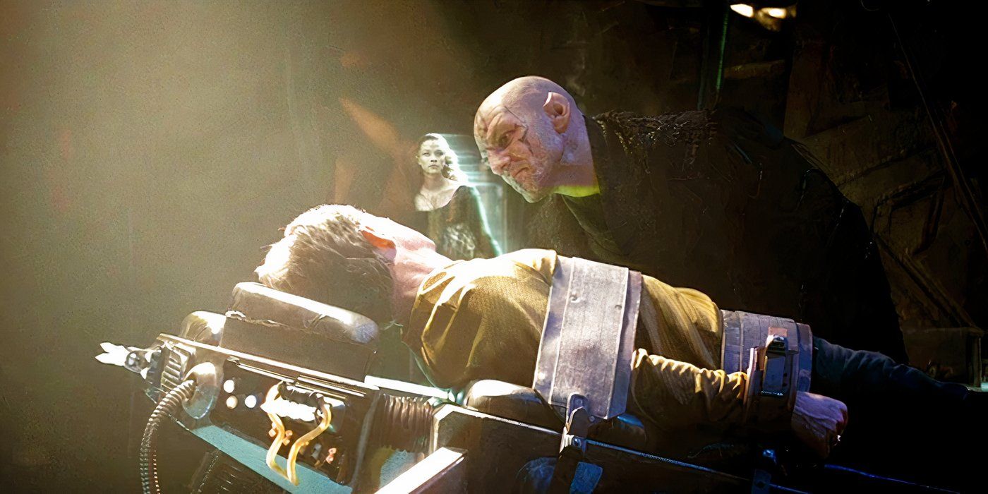 Romulan Captain Nero interrogates Starfleet Captain Christopher Pike while showing an image of hisdeceased wife in Star Trek (2009).