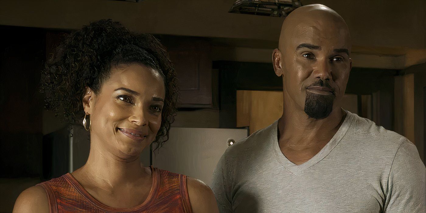 Nichelle and Daniel stand together smiling inside their home in SWAT