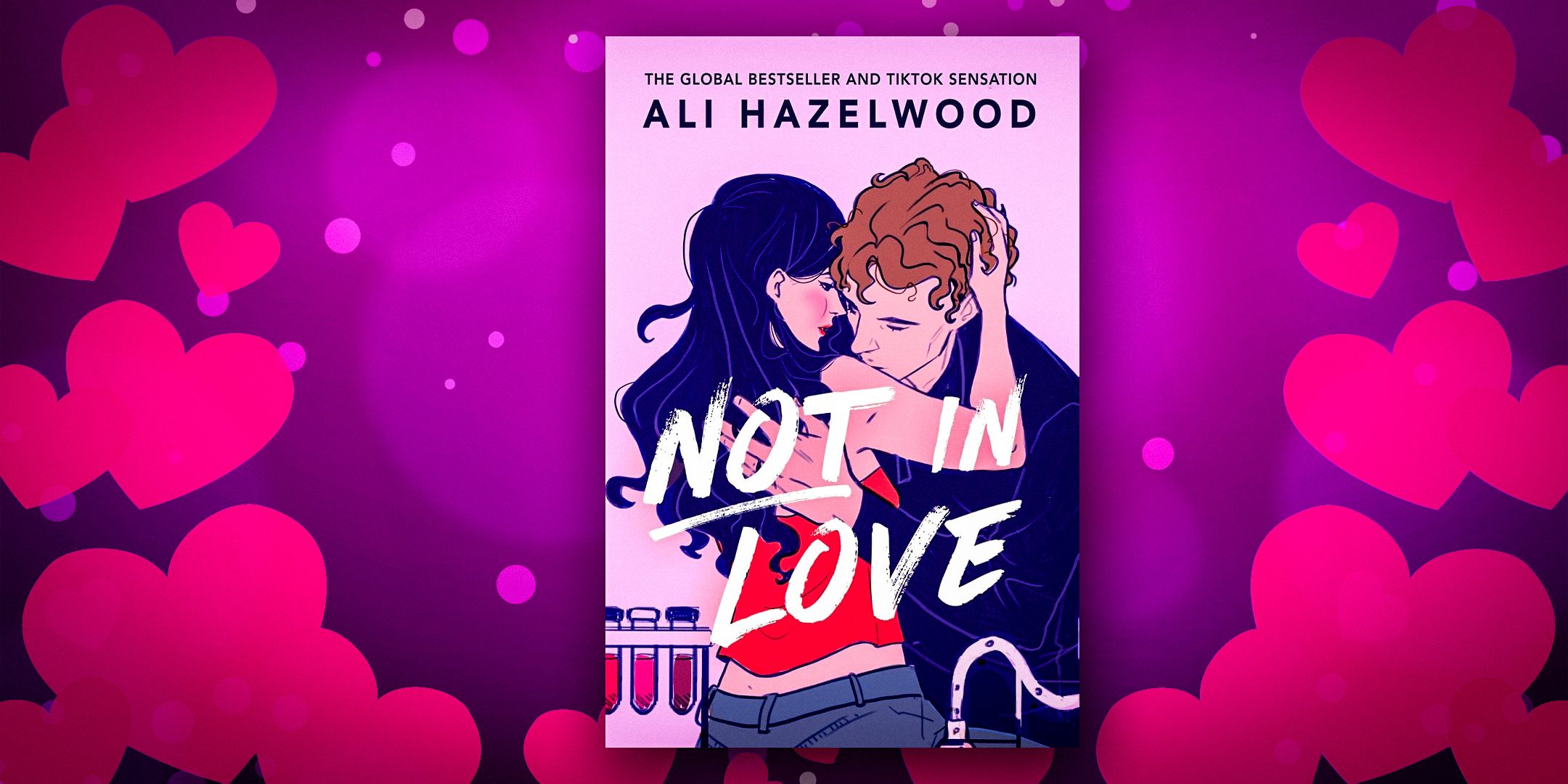 Not in Love by Ali Hazelwood Cover featuring a dark-haried woman and brunette man in an embrace