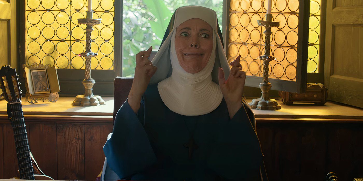 Olivia Colman pulling a face with her fingers crossed in Paddington 3