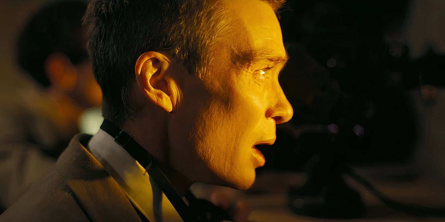 J. Robert Oppenheimer (Cillian Murphy) looks stunned as he watches the nuclear detonation at Los Alamos in Oppenheimer