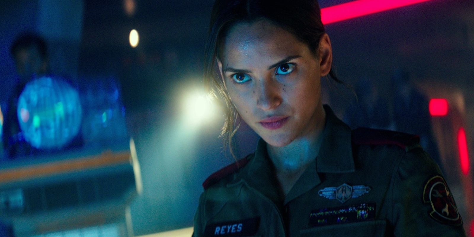 Adria Arjona in military clothing looking upward in Pacific Rim Uprising