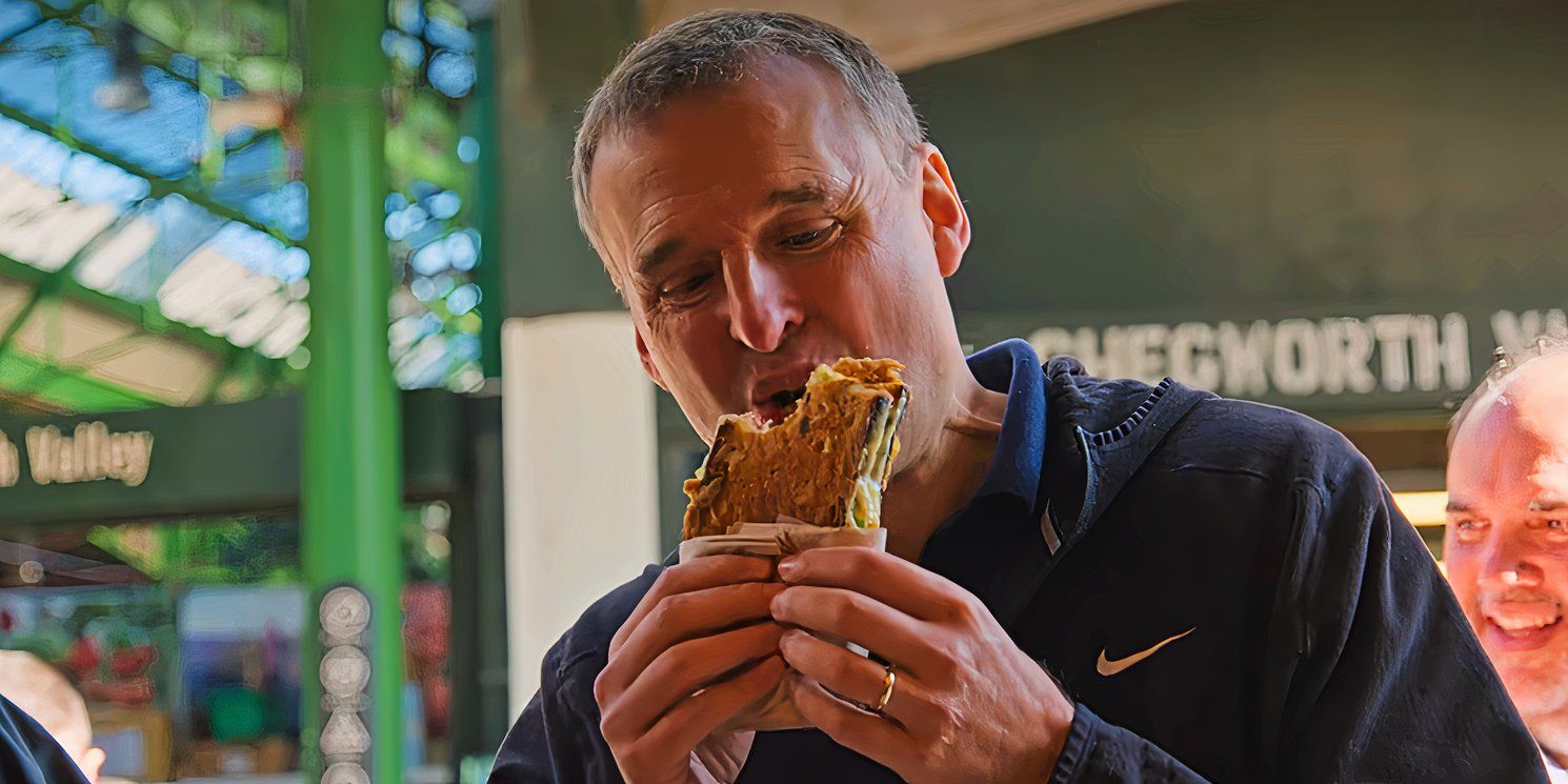 Phil Rosenthal eating a grilled cheese sandwich at Kappacasein's in Somebody Feed Phil season 3 episode 3