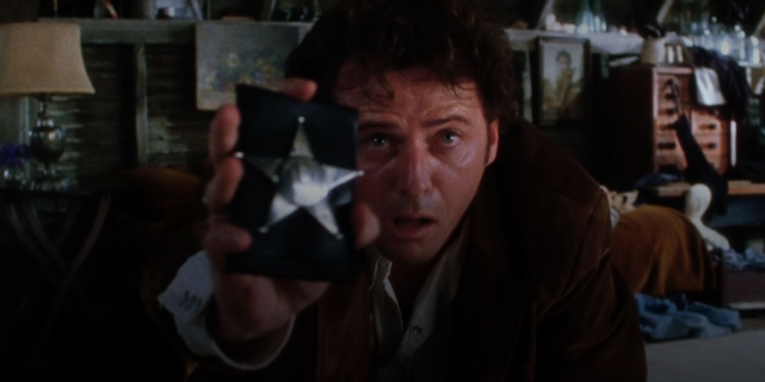 Aidan Quinn As Gary Hallet Holding Up His Badge Looking Scared In Practical Magic.jpg