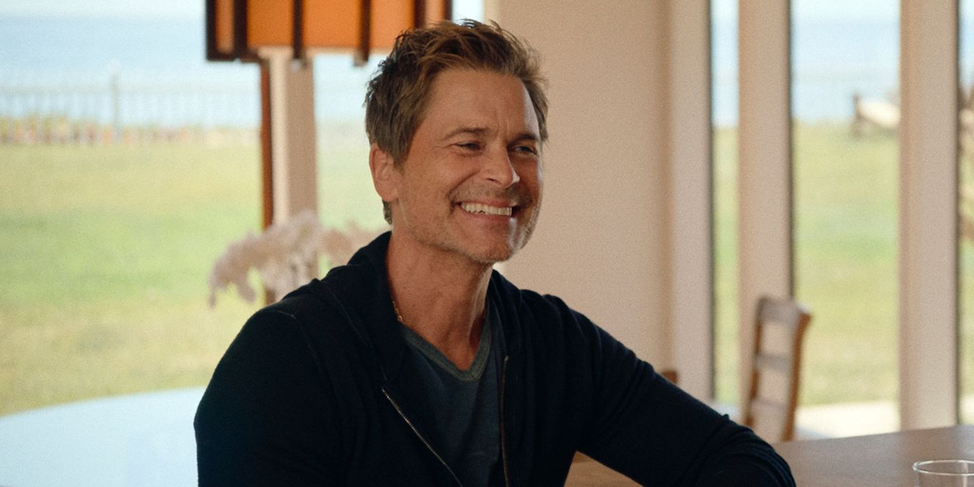 Rob Lowe smiling in a brightly lit room in Brats