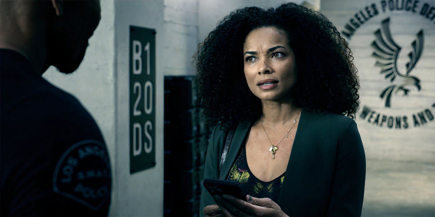 Rochelle Aytes as Nichelle looks angry while looking over her phone while speaking to Hondo in SWAT