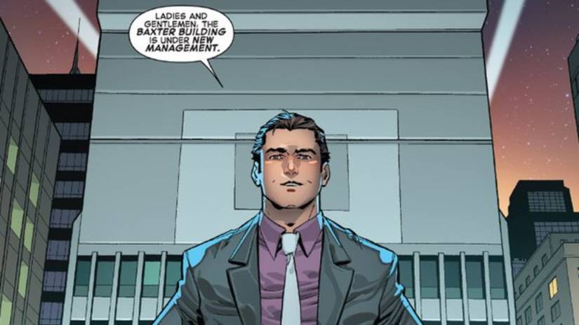Peter Parker standing in front of the new Parker Industries building.
