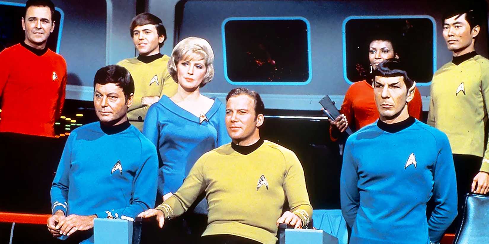 Scotty, Mccoy, Chekhov, Chapel, Kirk, Uhura, Spock, and Sulu on the bridge of the U.S.S. Enterprise as portrayed on Star Trek: The Original Series.