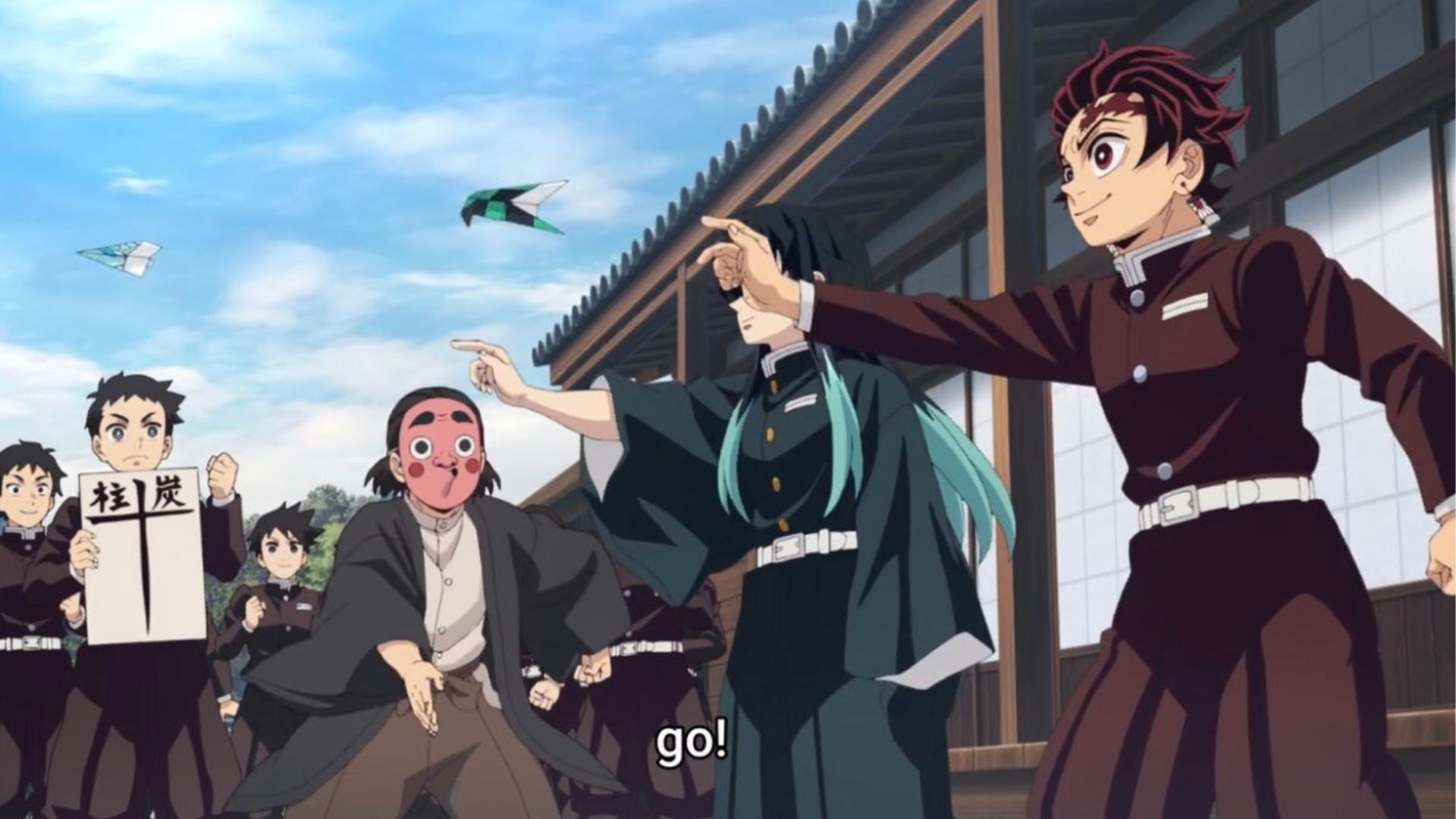 Tanjiro and Muichiro throw thei paper plane as the members of the demon slayer crops cheer for Tanjiro