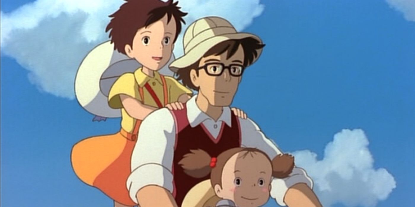 Tatsuo Kusakabe rides on a bike with his daughters.