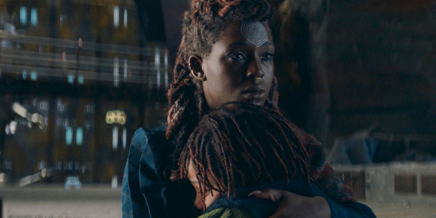 Mother Aniseya (Jodie Turner-Smith) embracing Little Osha in a farewell hug in The Acolyte season 1 episode 3