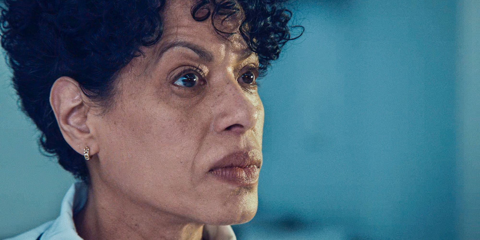 Tina (Liza Colón-Zayas) close up looking worried at the distance in The Bear Season 3 Episode 2