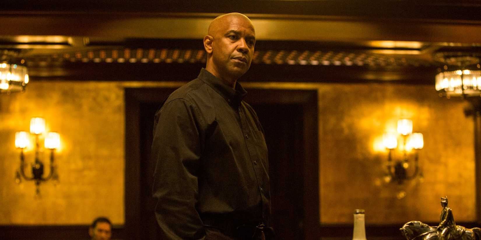 Denzel Washington wearing black and looking intense in The Equalizer