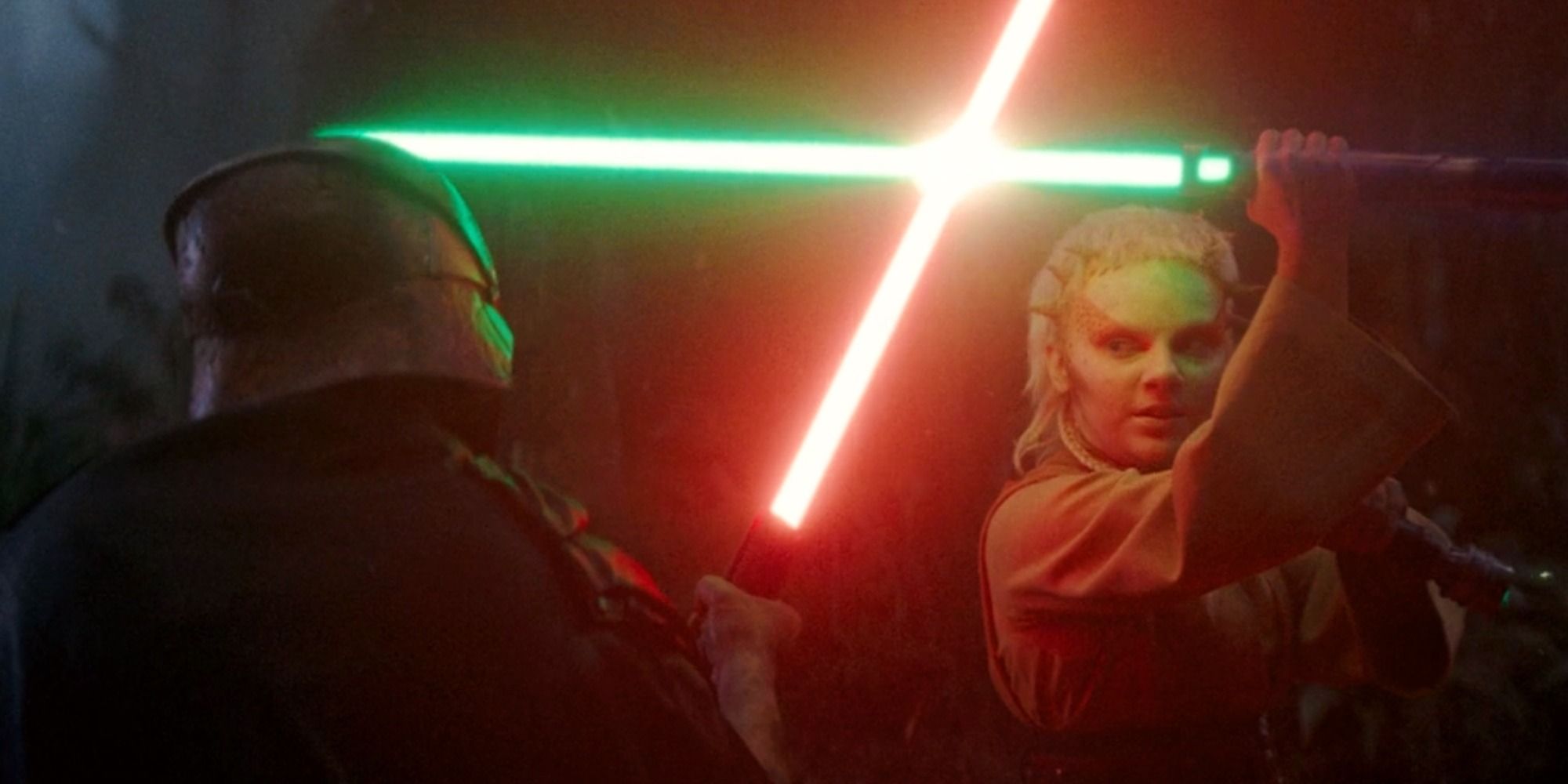 The Stranger and Jecki in a lightsaber fight with their lightsabers clashing