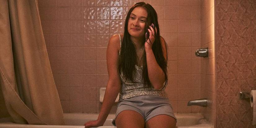 Belly on the phone in a bathroom in The Summer I Turned Pretty