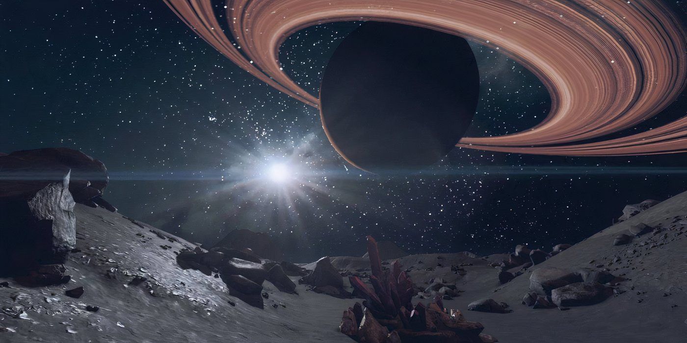 A superfície de uma das luas de Starfield, revestida com pequenas rochas e cristais, olhando para um planeta com anéis vermelhos a uma distância próxima. 