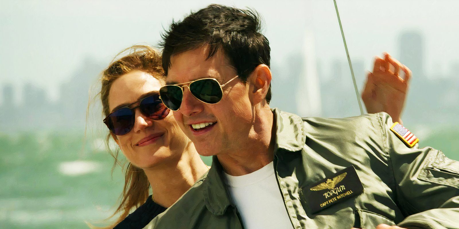 Tom Cruise and Jennifer Connelly on a sailboat in Top Gun Maverick