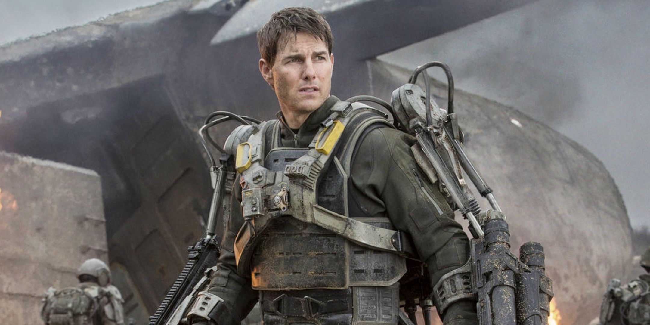 Tom Cruise wearing a robotic suit while looking tired and worn out in Edge of Tomorrow