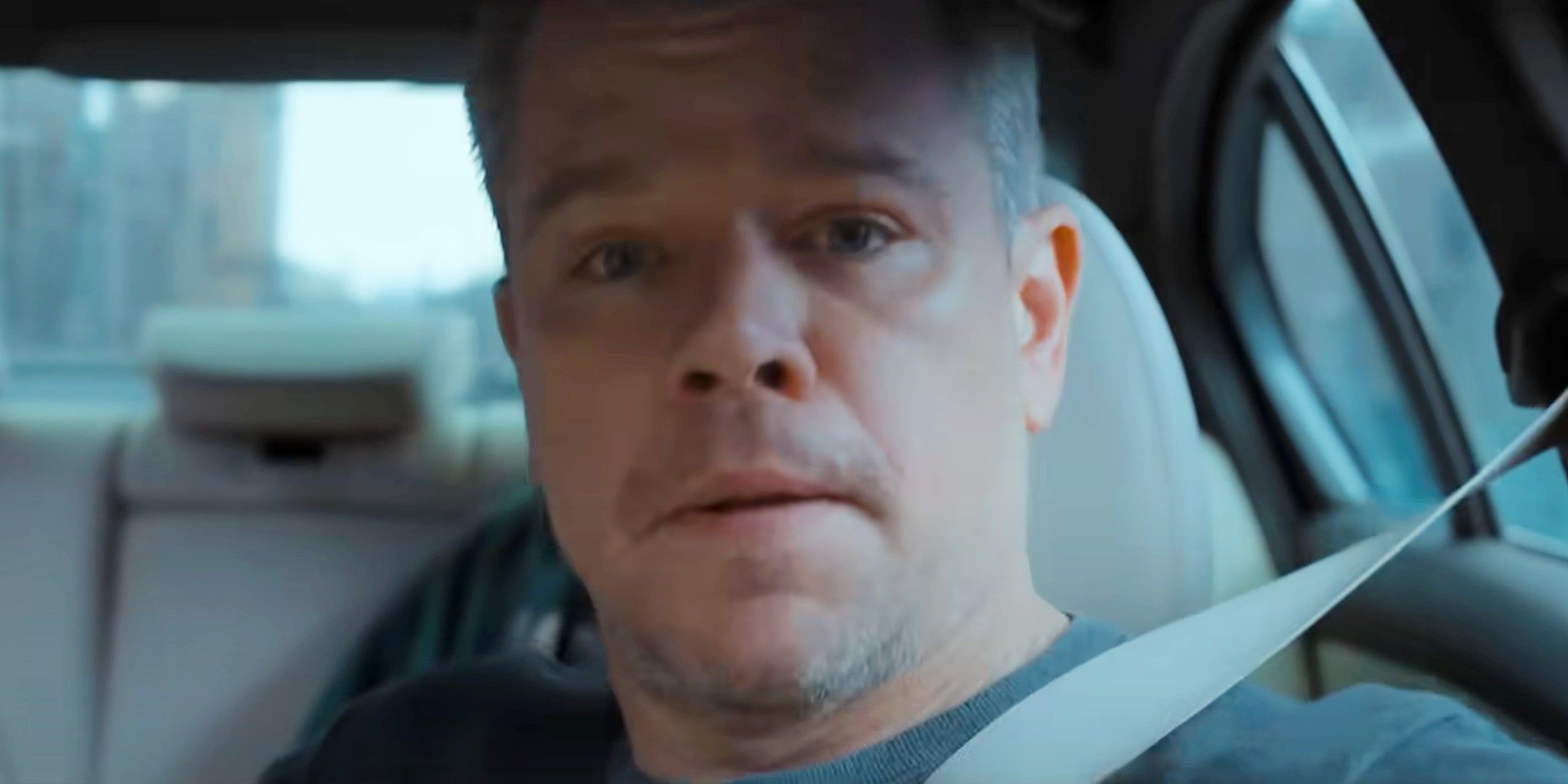 Matt Damon driving a car in The Instigators