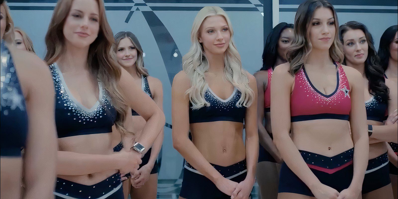 Dallas Cowboys Cheerleaders standing looking at the coach