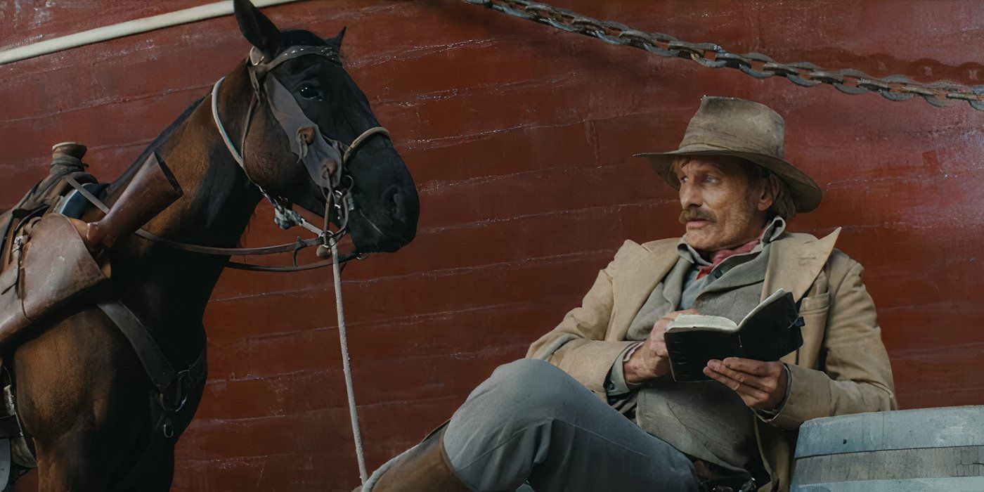 Viggo Mortensen reads a book next to a horse in The Dead Don&rsquo;t Hurt still