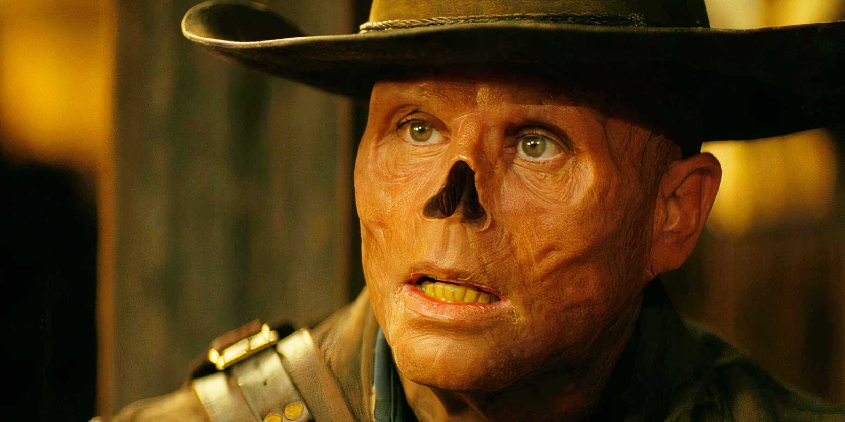 Walton Goggins as The Ghoul wearing a hat and looking curious in Fallout season 1